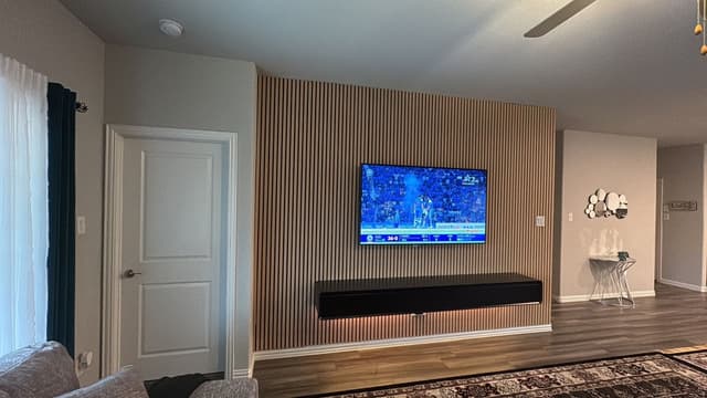 Gypsum Board Installation with Integrated Cabinetry Framework Gypsum board walls with integrated framework for built-in elements and precise measurements