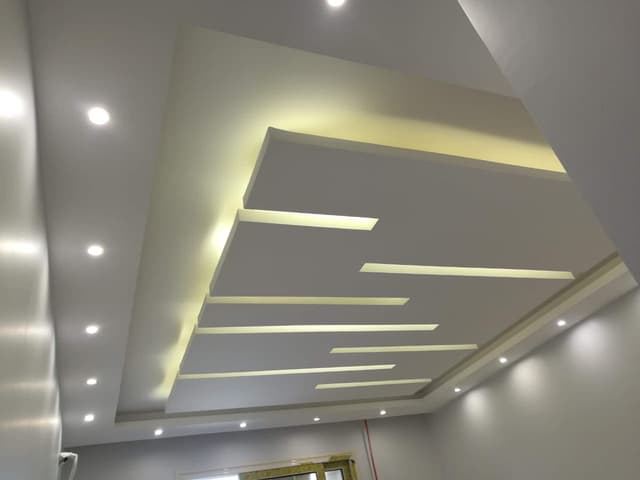 Large Window Gypsum Board Framing Gypsum board installation around large windows with precise measurements and clean finishing