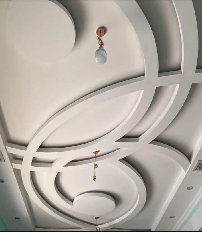 Gypsum Board Installation with Exposed Beam Integration Gypsum board work around exposed beams with precise cutting and rustic finishing techniques