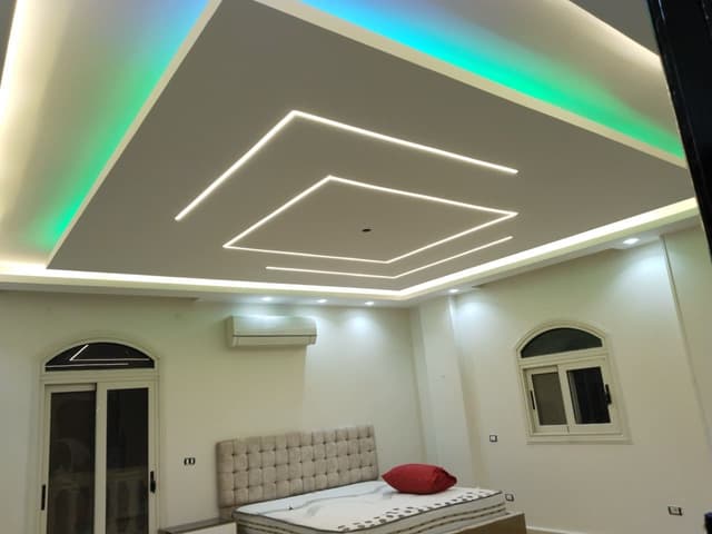 Stairwell Gypsum Board Installation Complex stairwell gypsum board installation with angled cuts and precise measurements